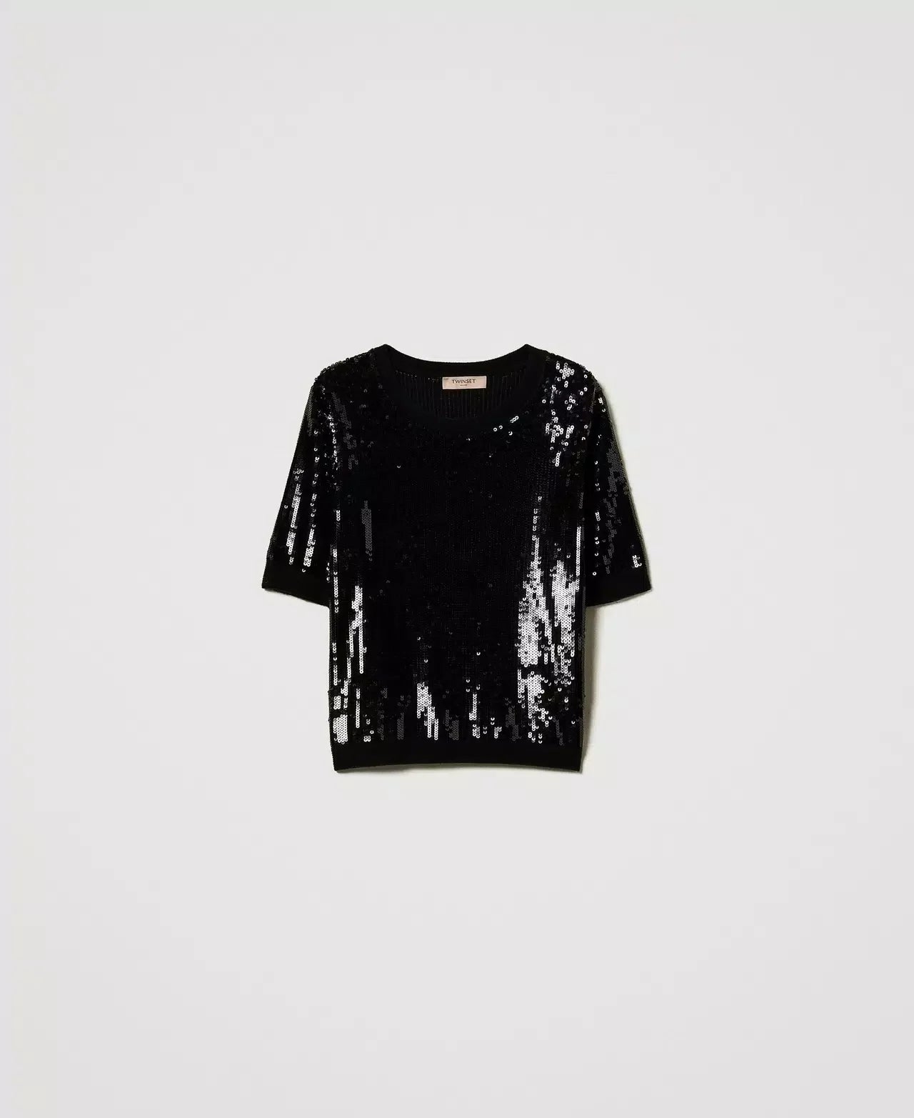 Women’s tops including shirts, blouses, T-shirts, and bodysuits styled as versatile upper-body pieces for refined everyday wear.