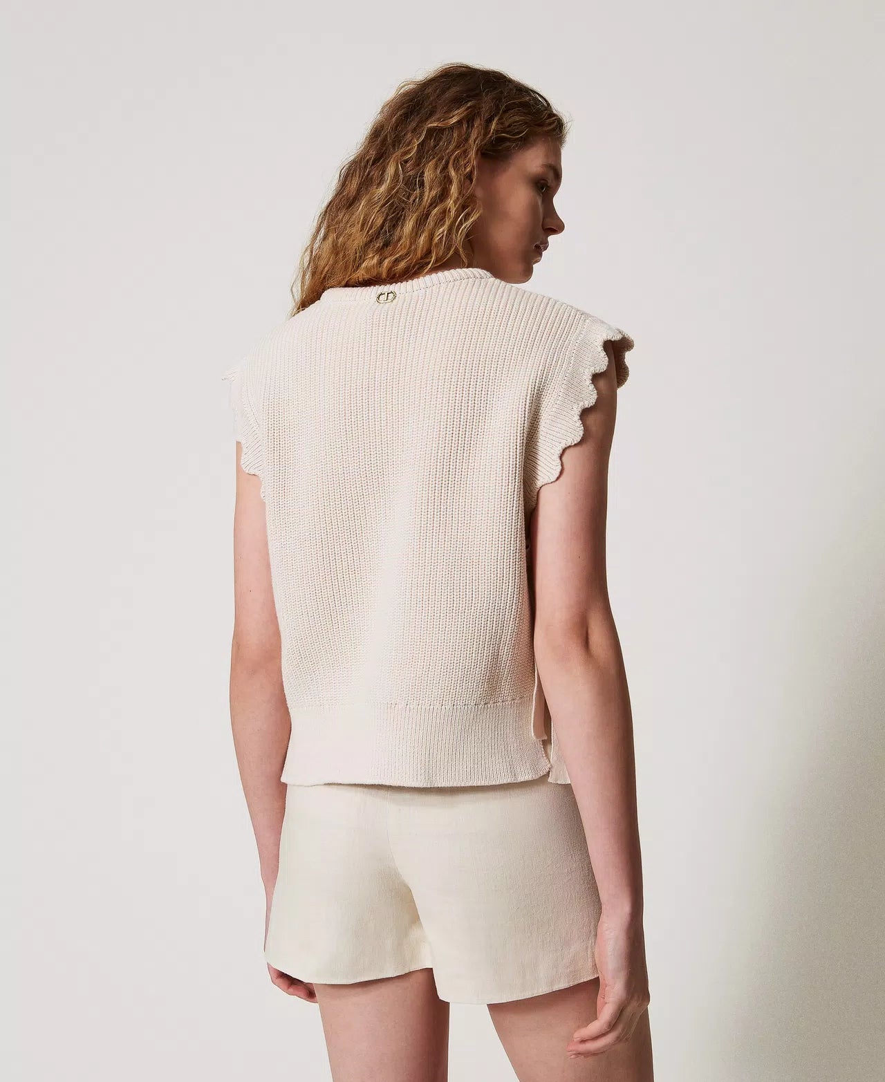 Knit top with embroidery and laces