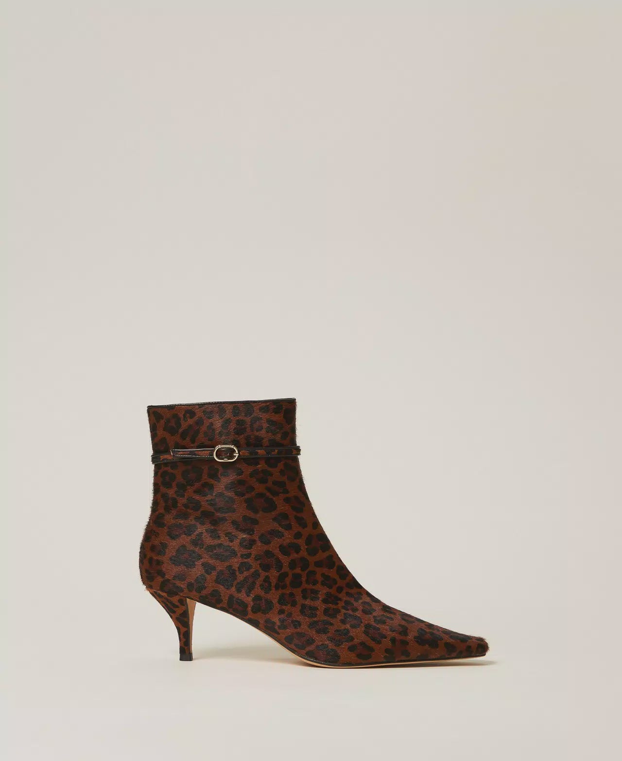 Leather ankle boots with animal print