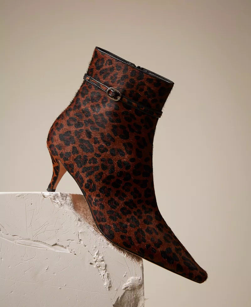 Leather ankle boots with animal print