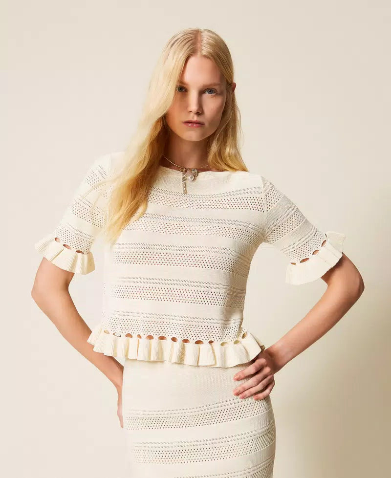 White jumper with ruffles