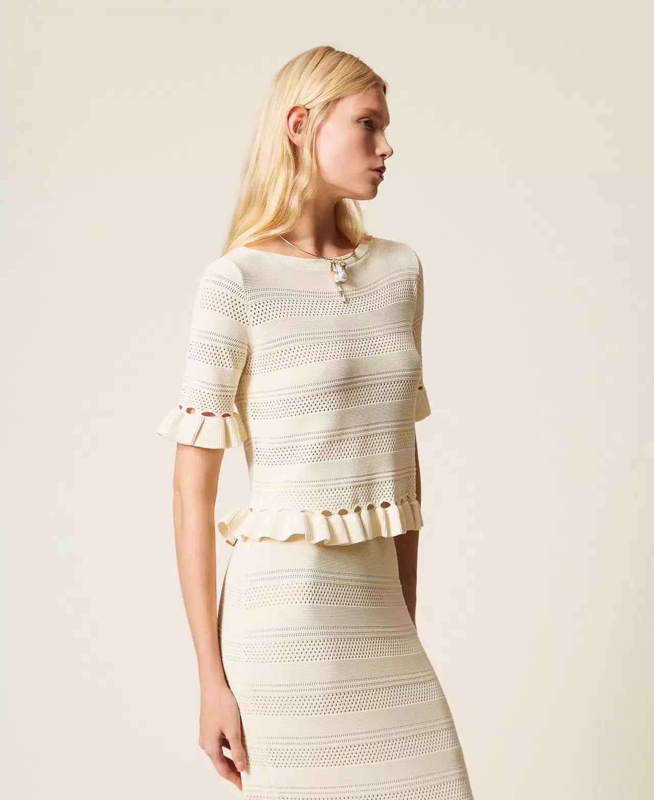 White jumper with ruffles