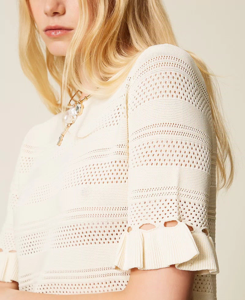White jumper with ruffles