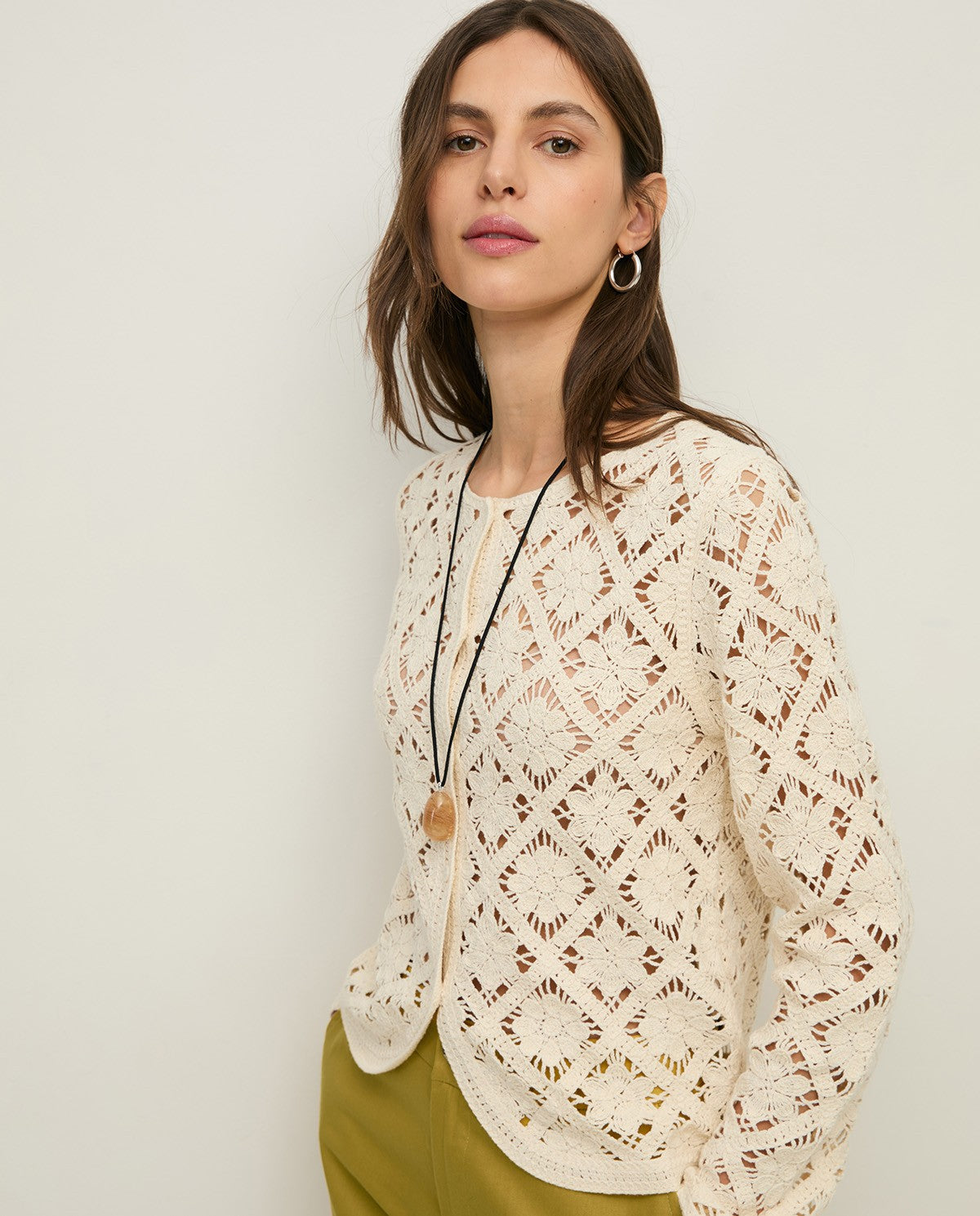 Crochet cardigan with rounded hemline