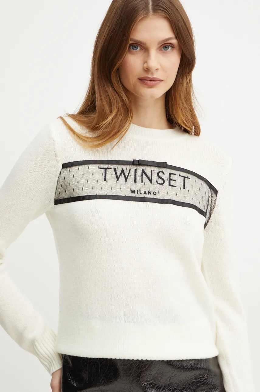 Cashmere blend sweater with appliqué
