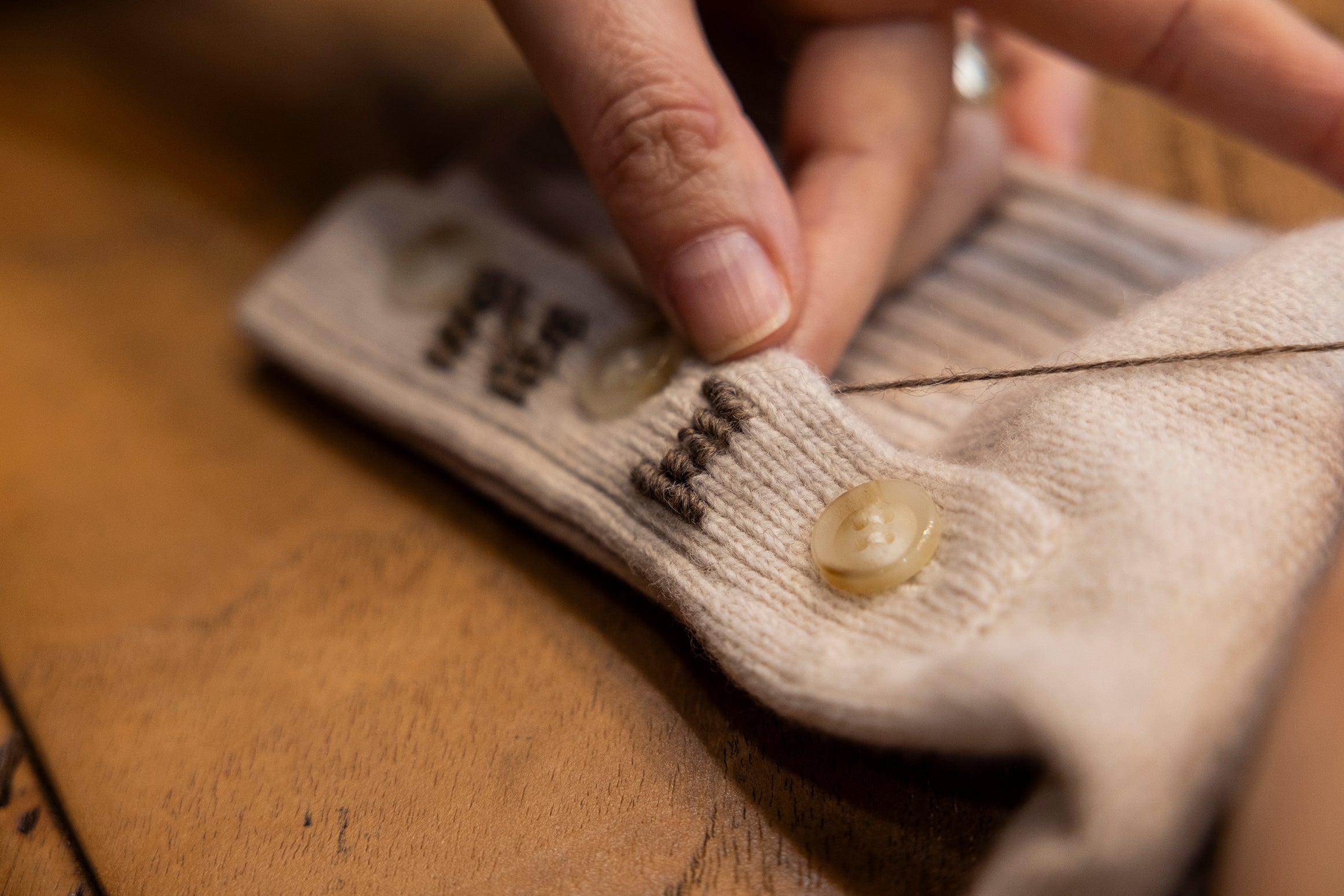 Handmade signature embroidery on the cuffs