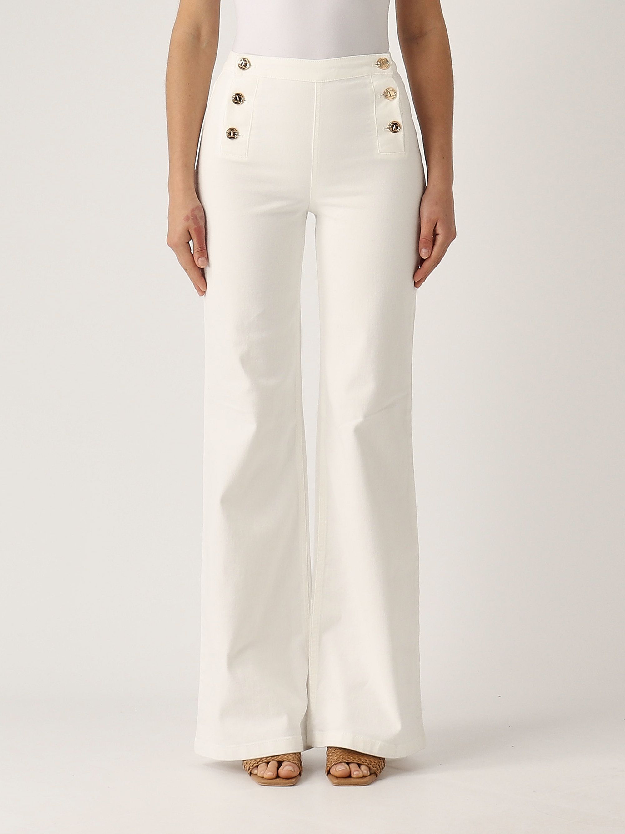 Flared jeans with golden buttons