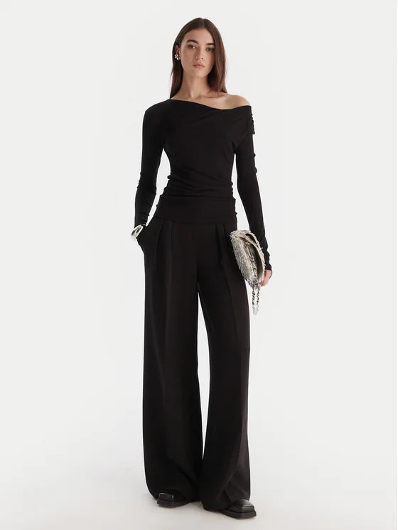 Top with asymmetrical neckline and draping
